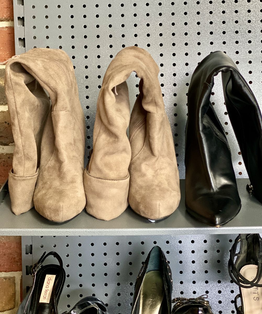 Boots on a garage storage shoe rack system