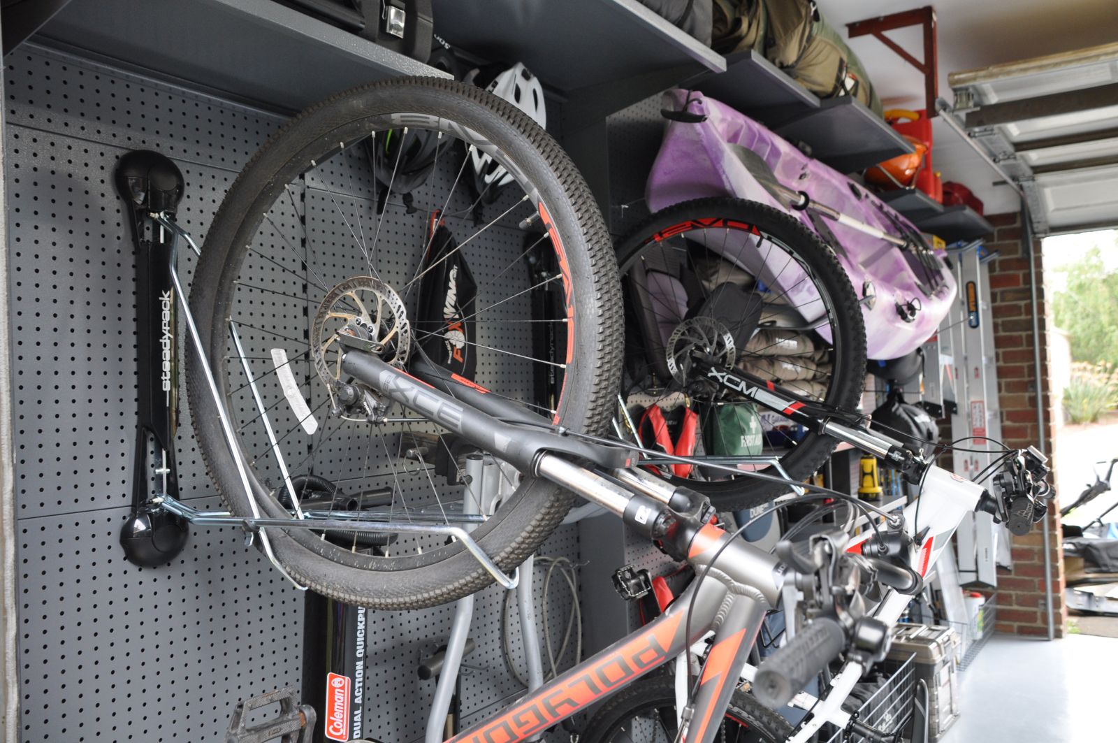 Pivoting bike rack on a garage wall