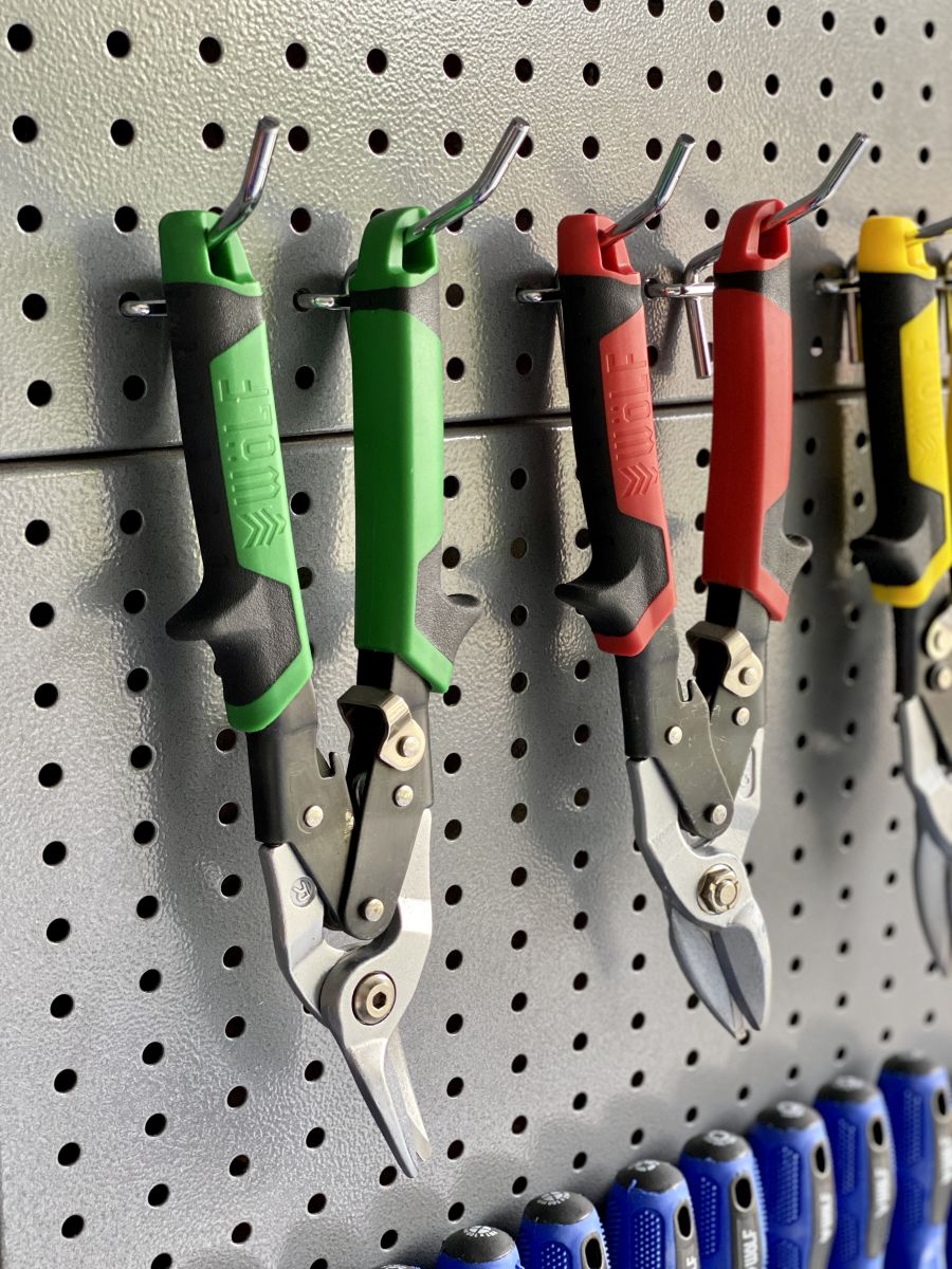 Garden shears hanging on a garage storage wall bay