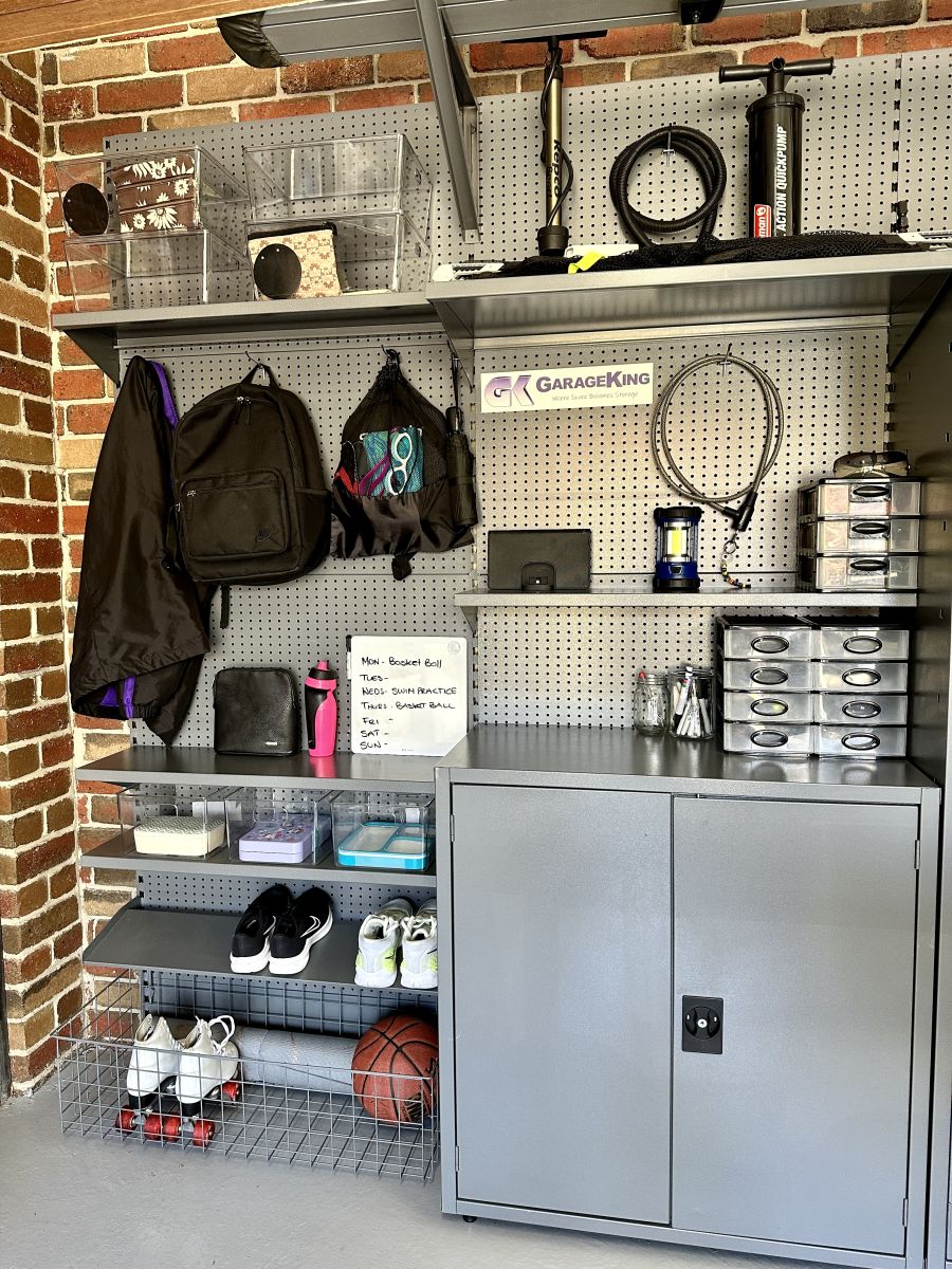 Garage mud room with kids school and sport items