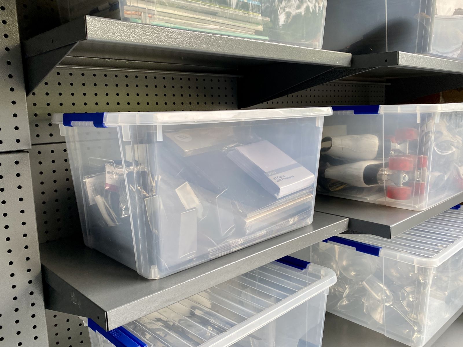 Garage storage shelf with plastic storage containers