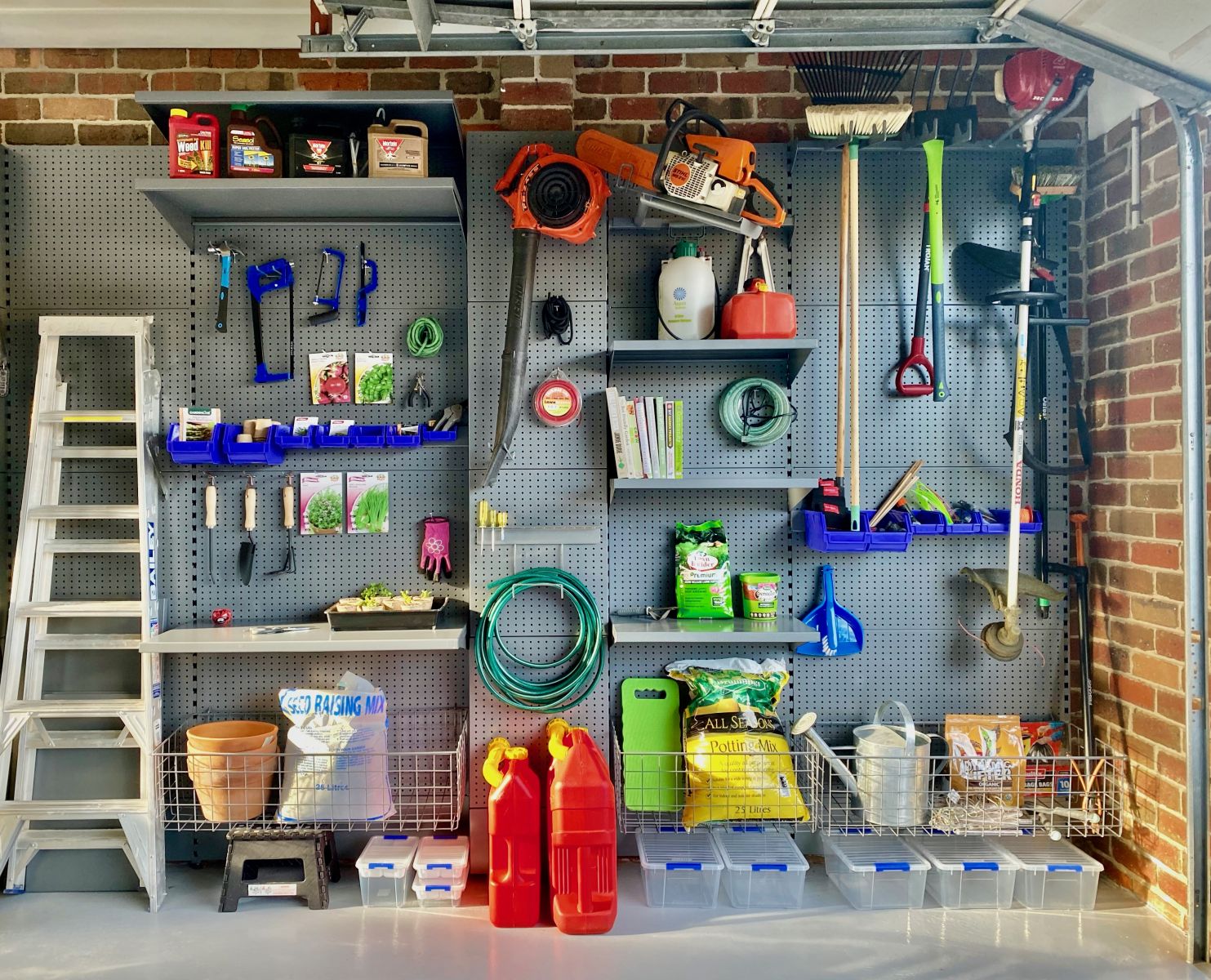 A garage storage system for gardening products with garden accessories and tools, soil enhancers and watering can.