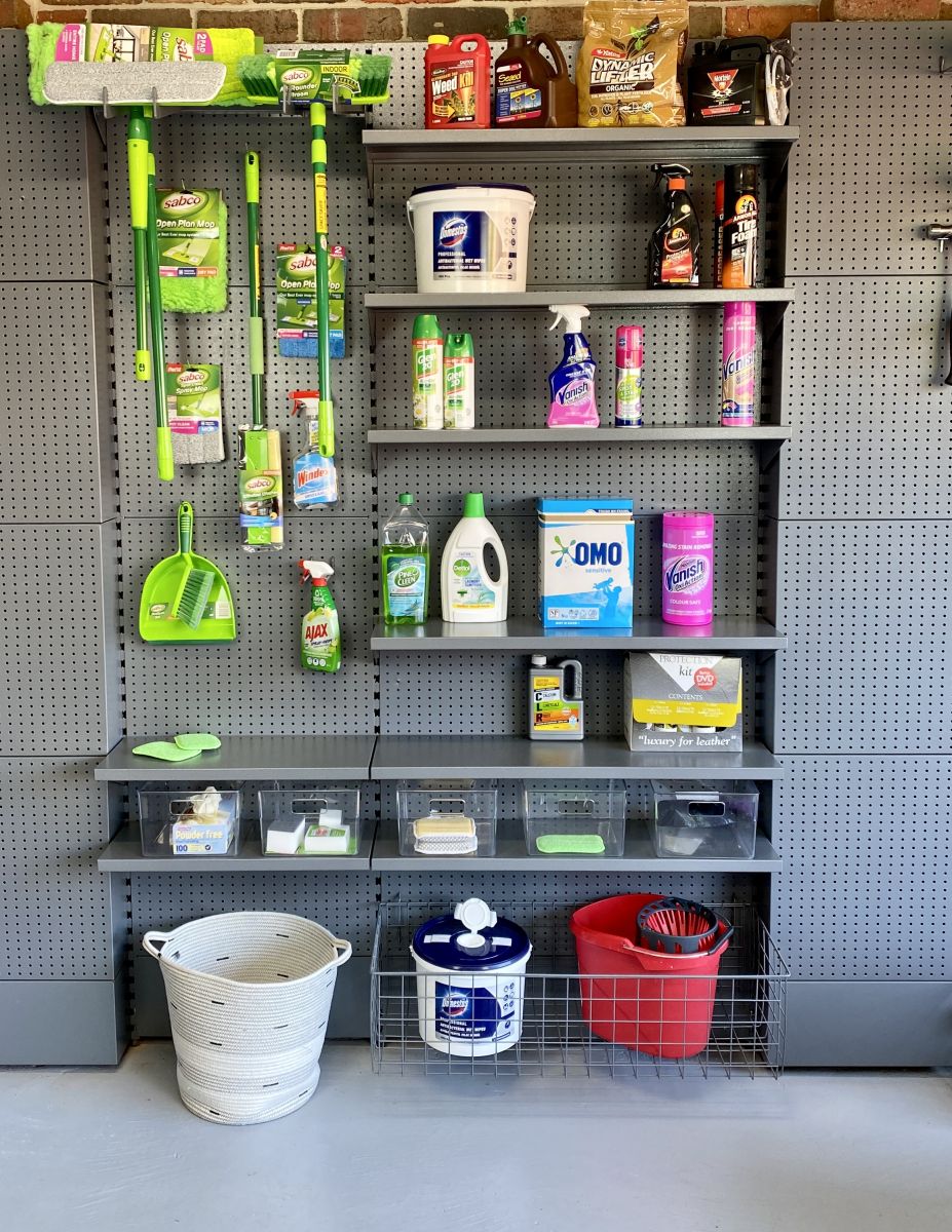 A laundry storage solution for the garage including sabco cleaning products, napisan, ono washing powder and glen 20